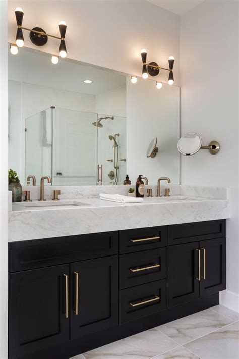 Brass Hardware Adds A Warm And Delicate Contrast To The Black Cabinets