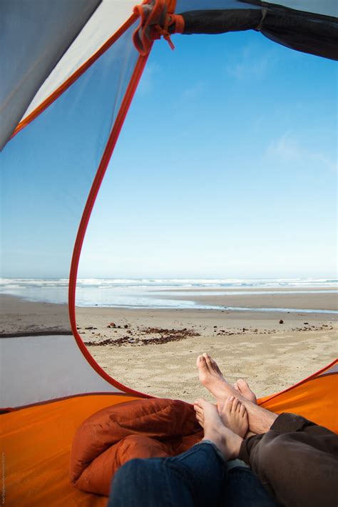 Couples Sandy Feet Sticking Out Of Tent Camping On The Beach By Stocksy Contributor Kate Ames