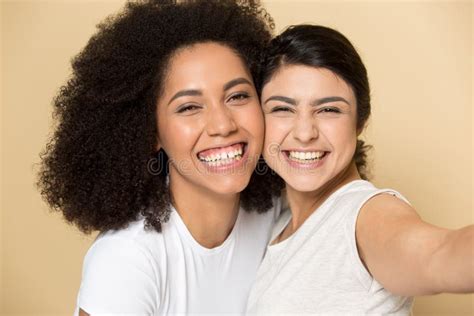 Happy Multiracial Millennial Girlfriends Make Selfie Together Stock
