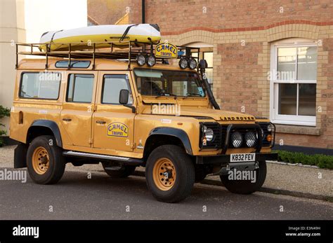 A Camel Trophy Land Rover Defender A Rugged Off Road Vehicle Parked
