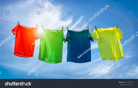 Tshirts Hanging On Clothesline Front Blue Stock Photo 1714874713