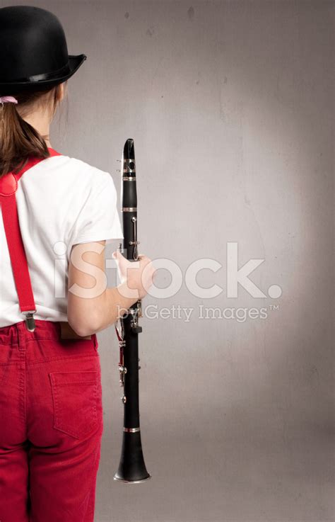 Little Girl Playing Clarinet Stock Photos