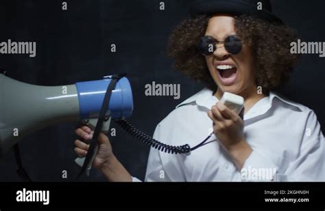 Rebellious Young Black Woman Screaming Into Loudspeaker Stock Video