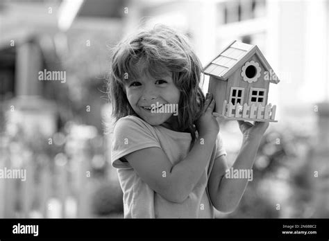 House in kids hands. Family home, home protecting insurance concept
