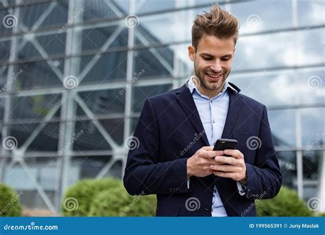 Handsome Office Worker Holding Smartphone And Smiling Happy Young Man