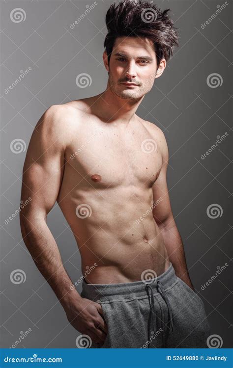 Muscular Athletic Bodybuilder Fitness Model Posing After Exercises Royalty Free Stock
