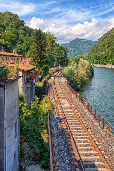 Railroad Along River In Italy Featuring Italy Train And River High