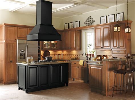 View all of our cabinet styles and choose your favorite quality cabinetry! Light Oak Cabinets with Black Kitchen Island - Kitchen ...