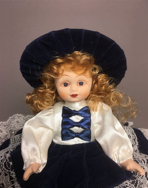 vintage bisque porcelain doll victorian style velvet midnight blue dress and hat golden brown