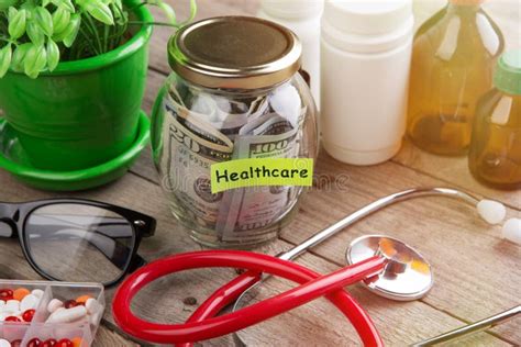 Saving Money For Health Care Insurance Money Glass Stethoscope