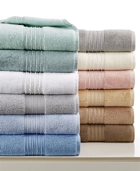 Towels Stacked On Top Of Each Other In Different Colors