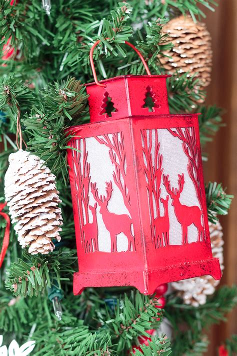 Christmas decorated porch with little trees and lanterns. Front Porch Decorating Ideas You'll Want to Copy for Christmas
