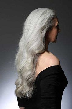 Nude Mature Woman With Medium Length Wavy Silvery Grey Hair In