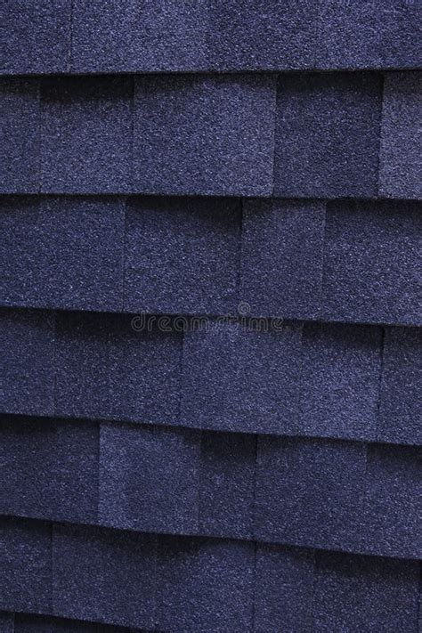 A Dark Blue Architectural Asphalt Roofing Shingles Background A Close