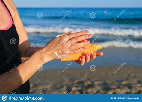 Close Up Of Woman Applying Suntan Lotion Sand Beach Blue Sea Background Stock Photo Image Of