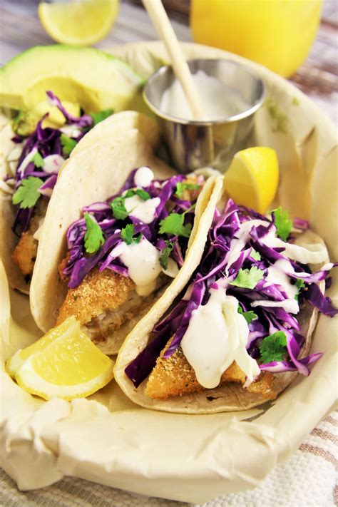 Crispy Fish Tacos With Cabbage Slaw And Lime Crema The Tasty Bite