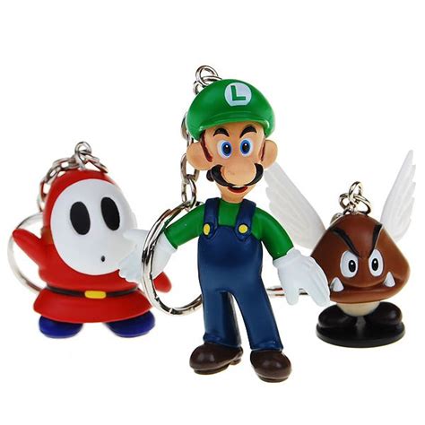 Three Different Key Chains With Mario And Luigi Characters On Them One