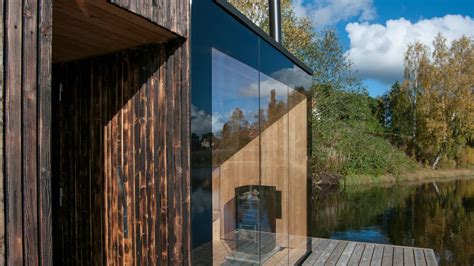 A Transparent Wall Of Glass Faces The Lake Inviting Introspection And