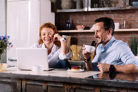 Couple Looking At Laptop While Having Breakfast Stock Image Image Of