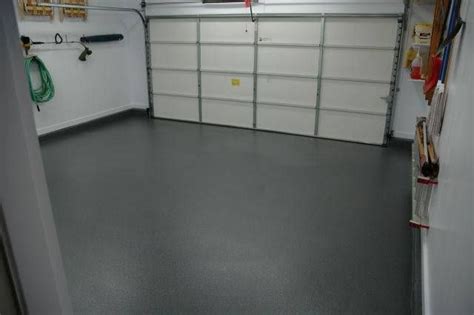 Whether you're looking to brighten up your garage with a bold solid, create a terrazzo or granite long lasting epoxy floor coatings from garageexperts will enhance the look of your garage, while making it easy to clean. Monochromatic dark gray floor for garage floor | Metallic ...