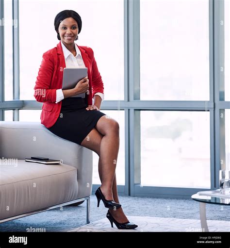 Square Image Of Well Dressed Young Black Corporate Woman Wearing A Red