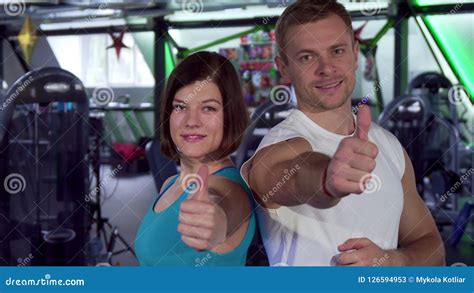 Fit Couple Shows Thumbs Up At The Gym Stock Image Image Of Caucasian
