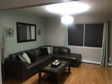 This gorgeous tropical oasis accent wall is featured on all sides and looks incredibly stunning. Sage green living room | Sage green living room, Living ...
