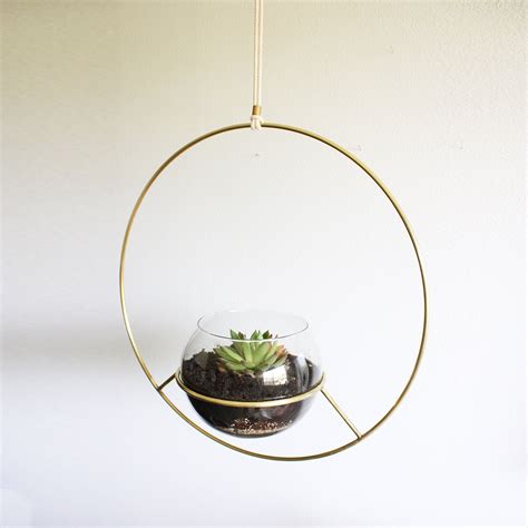 Adorn your space with planters, plant stands, and plant pots to hold your gorgeous greenery and herbs. Hanging Plant Holder- Raw Brass | Metal plant hangers ...