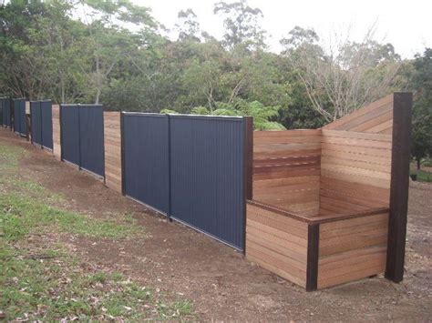 20+ captivating fence design ideas that you can try | homyracks. ironstone colourbond plus timber | Backyard fences ...
