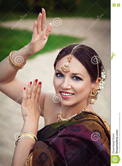 Woman In Traditional Indian Clothing With Oriental Makeup And Jewelry