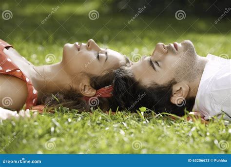 Couple In Love Lying On The Grass In The Park Stock Image Image Of Love Relaxing 63206623