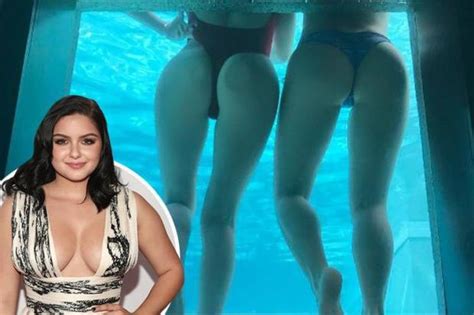 ariel winter posts a cheeky bottom snap as she poses in the pool with equally curvy pal the