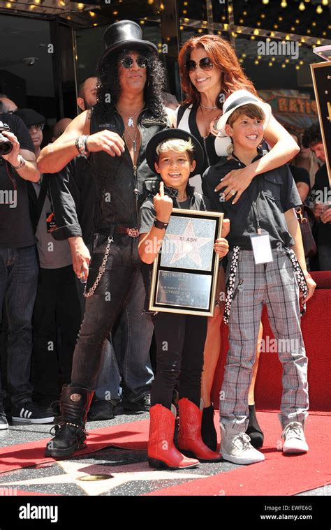 Los Angeles Ca July 10 2012 Rock Guitarist Slash And Sons And Wife