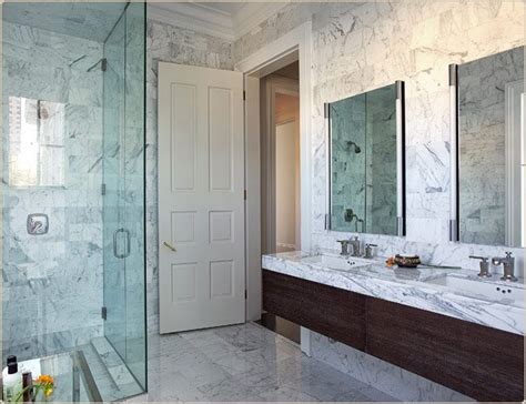 This bright marble shower by veronica martin design studio would make any feel fresh every morning. jon vaccari design | White marble bathrooms, White marble ...
