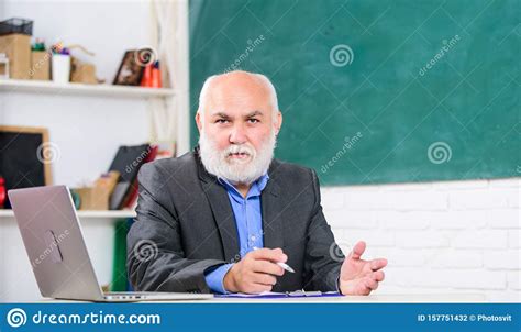 Senior Teacher At School Lesson University Tutor Man At Blackboard