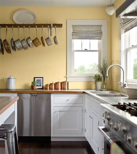 Pale Yellow Walls White Cabinets Wood Counter Tops Yellow Kitchen