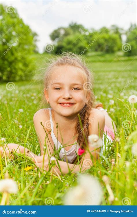 Beautiful Girl Laying On A Meadow Stock Image Image Of Front Hands