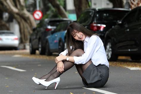 1421563 4K Asian Brunette Girl Sitting Hands Glove Dress Legs