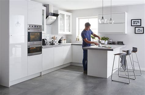 Simplistic rainier slab kitchen cabinets are the perfect choice for a space that you want to feel open and airy, free of much distraction and clutter. IT Santini Gloss White Slab | DIY at B&Q