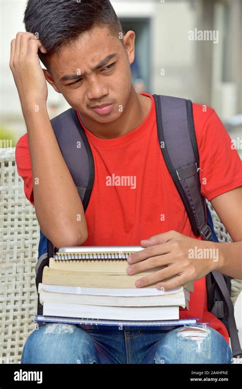 Thoughtful Young Asian Boy Student Stock Photo Alamy