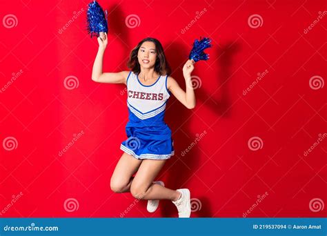 Young Beautiful Chinese Girl Smiling Happy Wearing Cheerleader Uniform