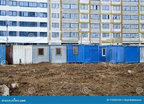 Small Temporary Houses Of Builders From Containers At An Industrial