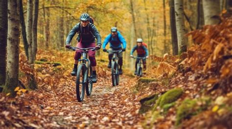 Premium Photo Group Of Friends Ride Mountain Bike In The Forest Together