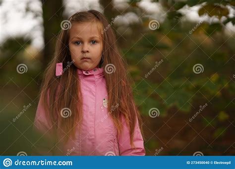 Portrait Of Upset Little Girl Wearing Pink Expressing Negative Emotions