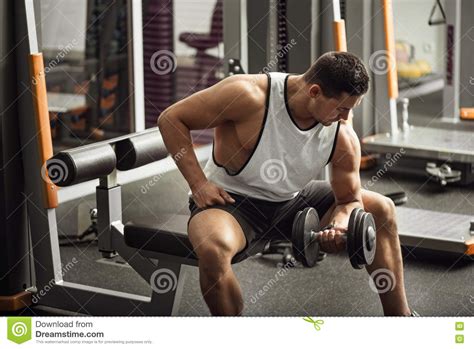 Strong Professional Weightlifter Lifting A Dumbbell Stock Photo Image