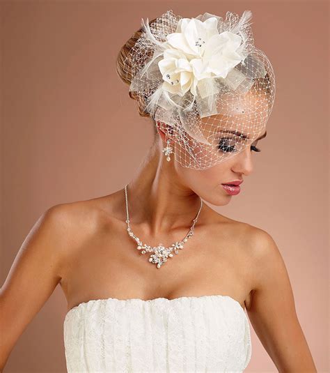Stand Out Of The Crowd In This Stunning Ivory Veiled Flower Fascinator