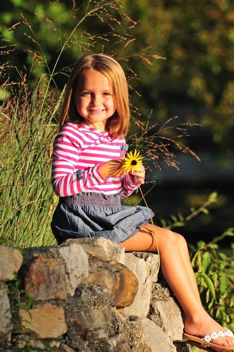 Happy Little Girl Holding A Flower Stock Photo Image Of Cute Flowers