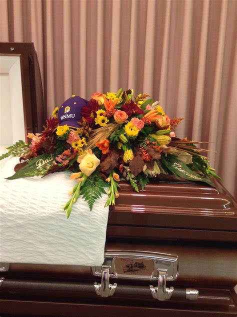 Fall flowers are just the right choice for a man's funeral. Added touch