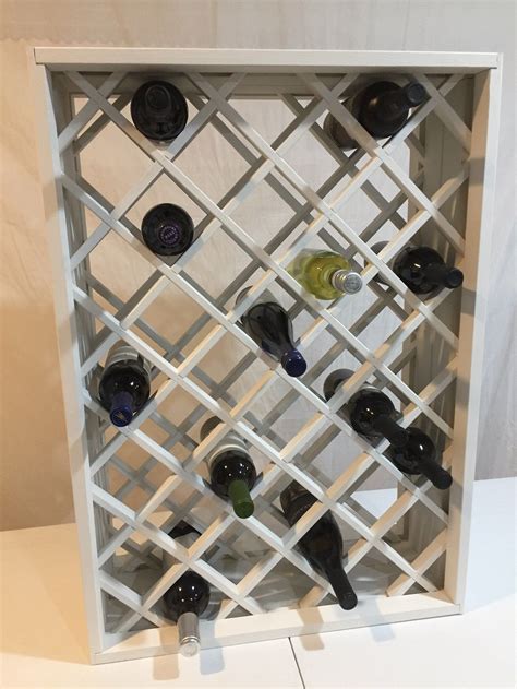 Great for yarn, wine bottles, spray cans and rolls of vinyl, fabric or paper. Diamond lattice wine rack | Bottle rack, Wine rack, Oak ...