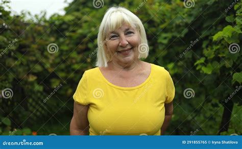 Portrait Of An Attractive Mature Woman Posing At The Park Stock Video